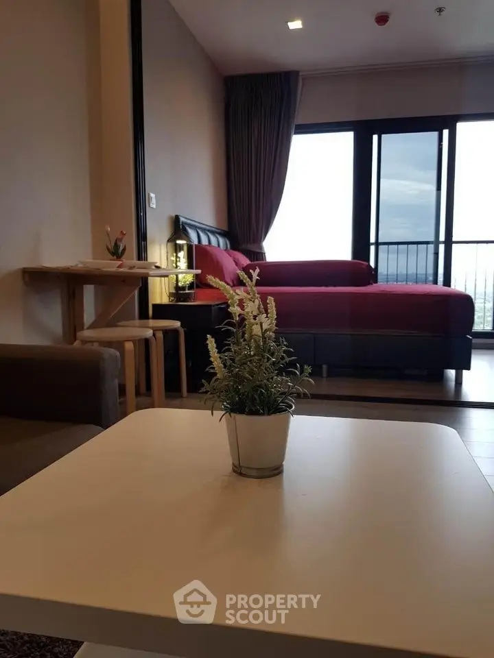 Modern living room with stylish decor and large windows offering a stunning view.