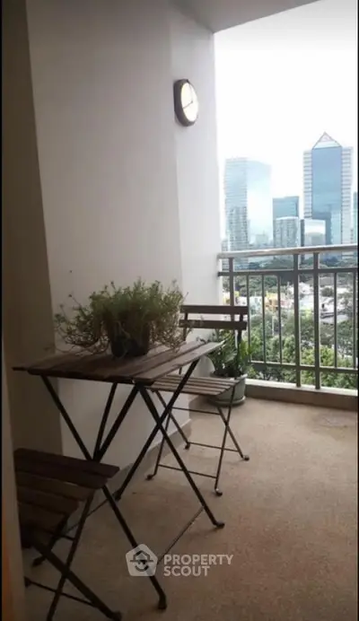 Charming balcony with city view, perfect for relaxing and enjoying the skyline.