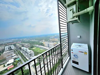 Stunning high-rise balcony with panoramic city views and modern washing machine.