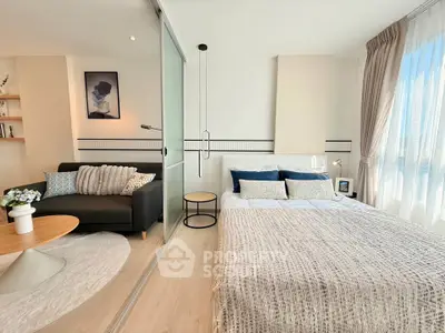 Modern studio apartment with cozy living area and stylish decor
