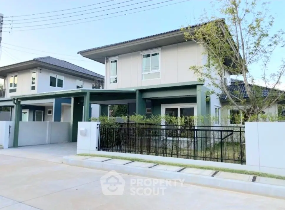 Modern two-story house with sleek design and spacious driveway in a serene neighborhood.
