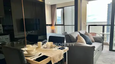 Modern open-plan living room with balcony and city view
