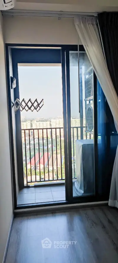 Charming balcony view with cityscape and cozy interior details