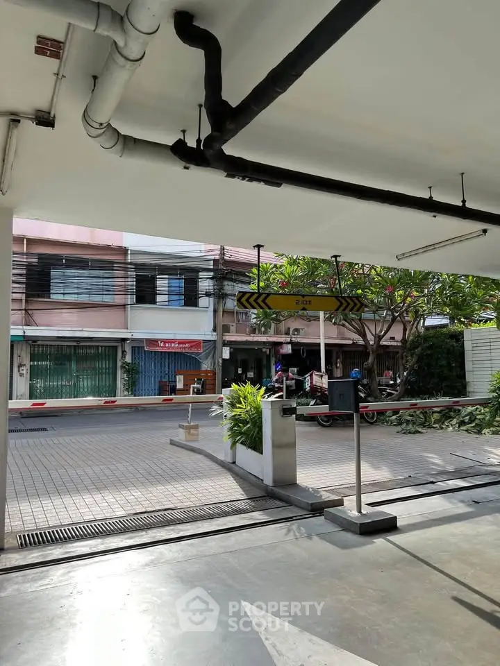 Parking area with street view and security barrier in urban setting