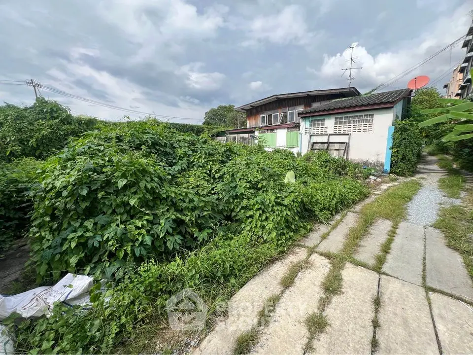 Charming rustic property with lush greenery and potential for development.