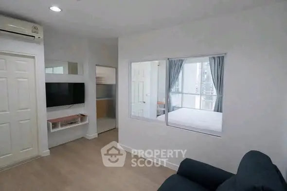 Modern apartment interior with bedroom view through glass partition