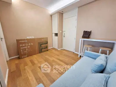 Cozy living room with modern decor and new Toshiba TV box on wooden floor