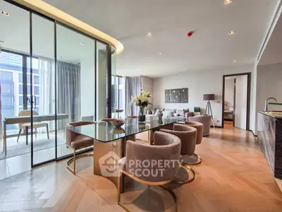 Luxurious open-plan living room with elegant dining area and modern decor