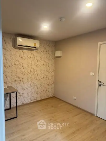 Minimalist room with air conditioning and modern decor, perfect for a cozy living space.