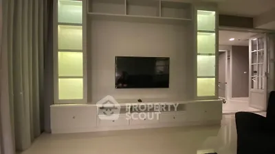Modern living room with sleek TV unit and ambient lighting