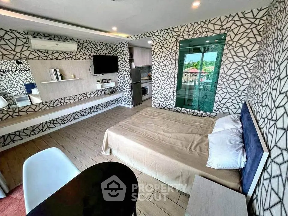 Modern bedroom with stylish decor and balcony view