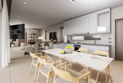 Modern open-plan kitchen and dining area with sleek design and natural light.