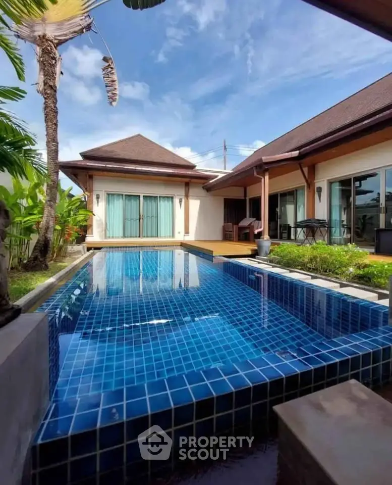 Luxurious villa with private pool and lush garden, perfect for tropical living.