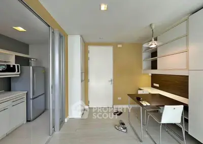 Modern kitchen and study area with sleek design and ample storage space
