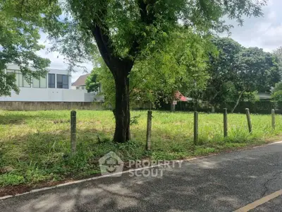 Prime vacant land for sale with lush greenery and potential for development.