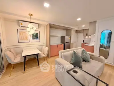 Modern open-plan living room with stylish dining area and contemporary kitchen.