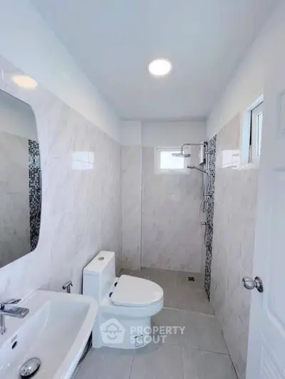 Modern bathroom with sleek fixtures and elegant tile design