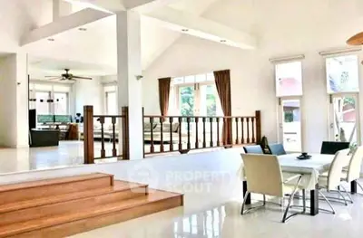 Spacious open-plan living and dining area with elegant design and natural light.
