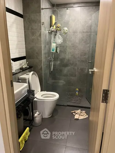 Modern bathroom with glass shower and sleek tile design