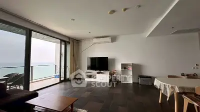 Spacious living room with ocean view and modern furnishings