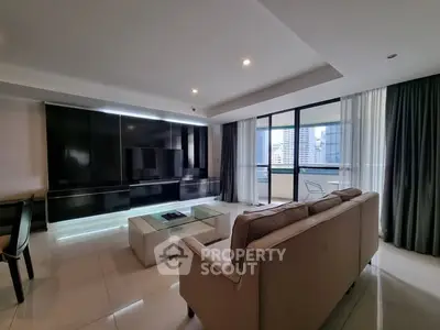 Spacious modern living room with sleek design and city view balcony.