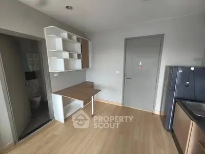 Modern compact kitchen with sleek design and integrated workspace