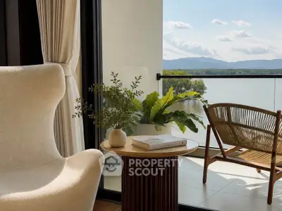 Luxurious balcony with stunning lake view, elegant seating, and lush greenery for serene relaxation.