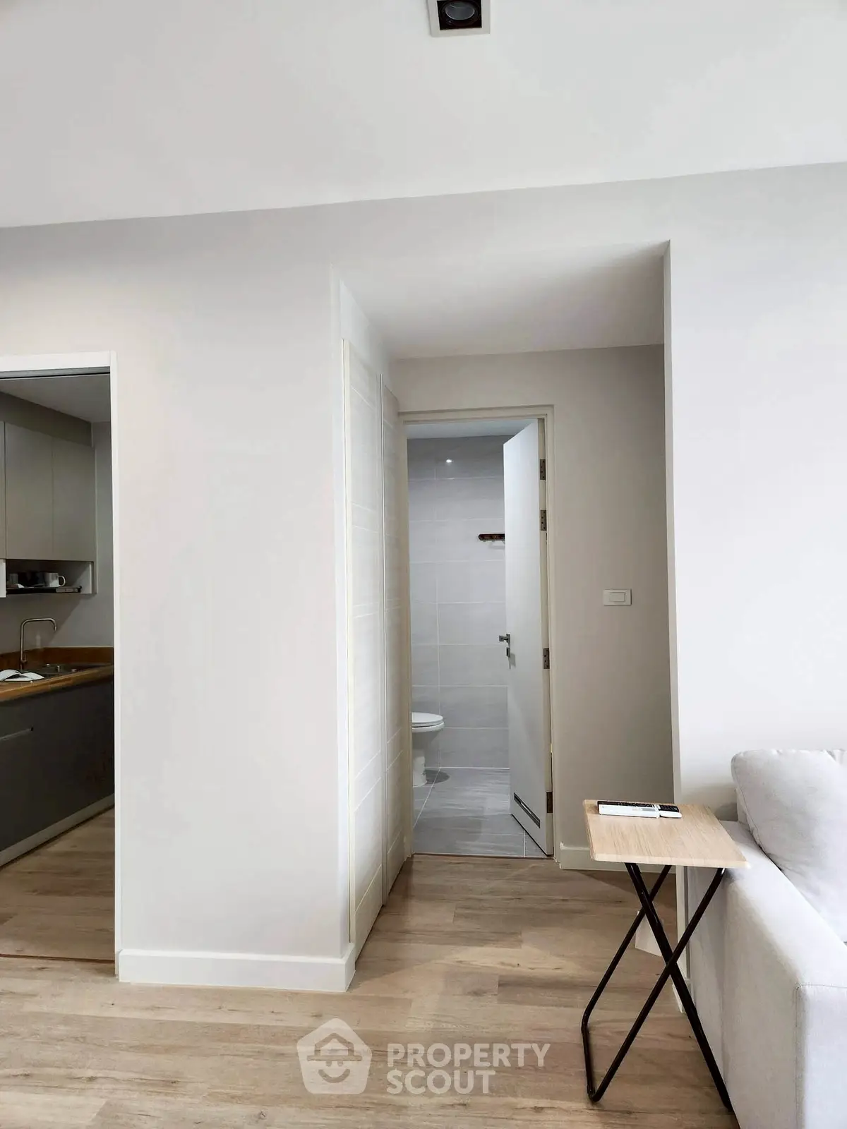 Modern apartment interior with sleek kitchen and cozy living area