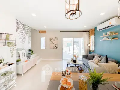 Spacious and stylish living room with modern decor and abundant natural light.