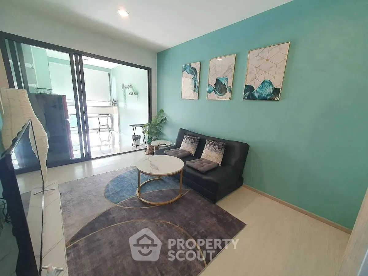 Modern living room with stylish decor and balcony view