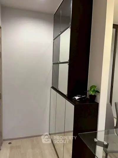 Modern hallway with sleek storage cabinets and minimalist decor