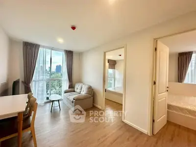 Bright and airy apartment living room with city view and modern furnishings.