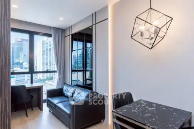 Modern living room with city view, stylish lighting, and sleek furniture in a high-rise apartment.