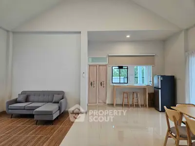 Spacious modern living room with open kitchen and stylish furniture