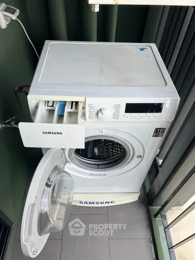 Modern Samsung washing machine on a balcony in a stylish apartment.