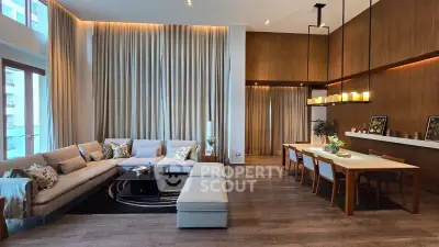 Luxurious modern living room with elegant dining area, high ceilings, and stylish decor.