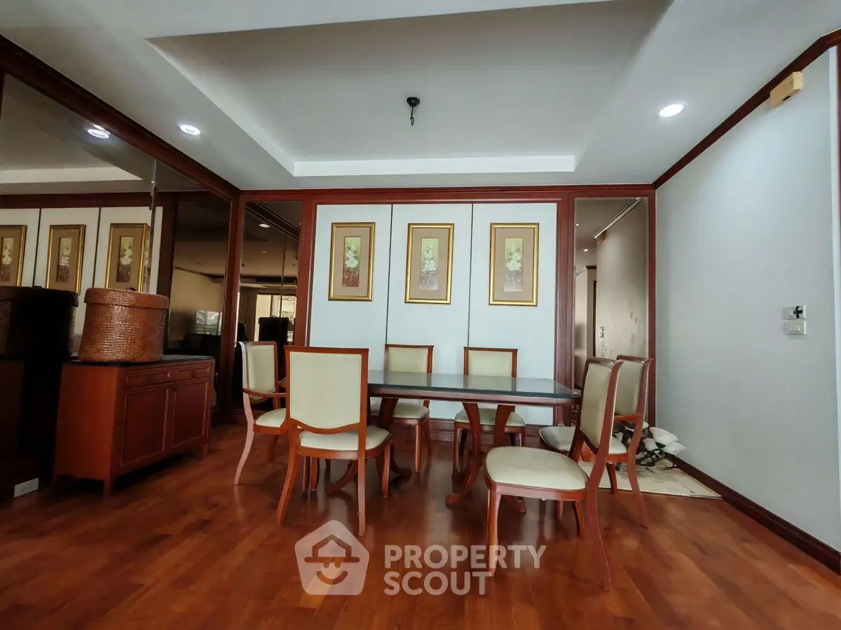 Elegant dining room with wooden flooring and stylish furniture