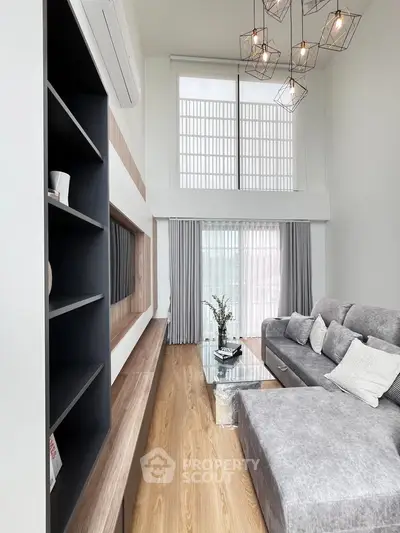 Luxurious modern living room with high ceilings and elegant decor