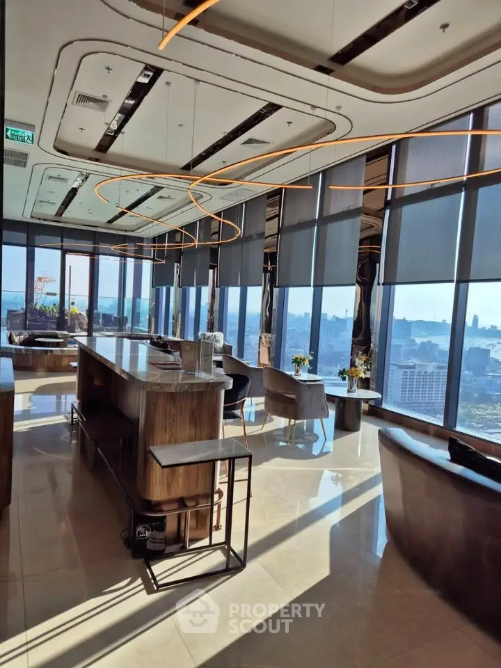 Luxurious high-rise building interior with panoramic city views and modern furnishings.