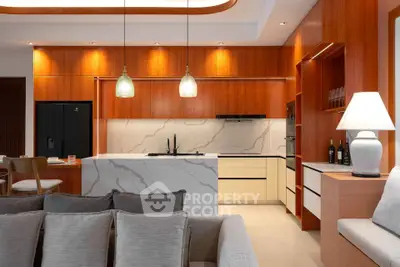 Modern kitchen with open layout and stylish lighting in luxury apartment
