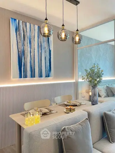 Stylish dining area with modern decor and elegant lighting in a cozy apartment.