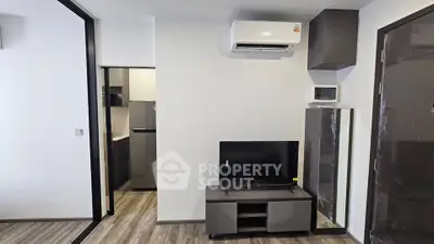 Modern living room with sleek furniture and air conditioning unit