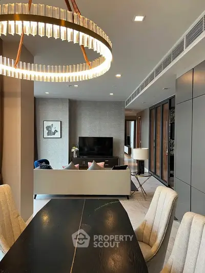 Luxurious modern living room with elegant chandelier and stylish decor