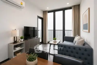 Modern living room with stylish furniture and large windows offering a bright and airy atmosphere.