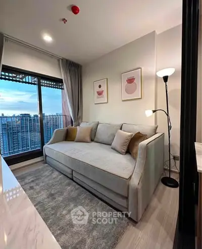 Modern living room with stylish sofa and city view from large window