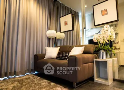Stylish living room with modern decor, cozy sofa, and elegant lighting in a chic apartment.