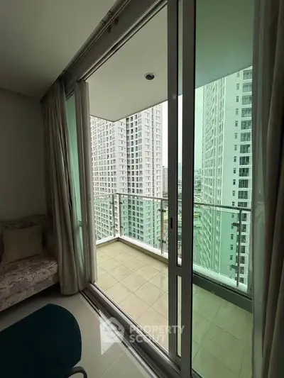 Spacious balcony with city view in modern high-rise apartment