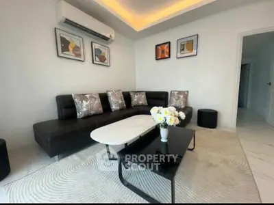 Modern living room with stylish black sofa and elegant decor