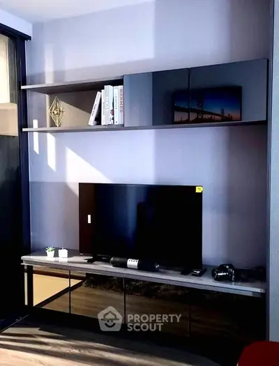 Modern living room with sleek TV unit and stylish shelving