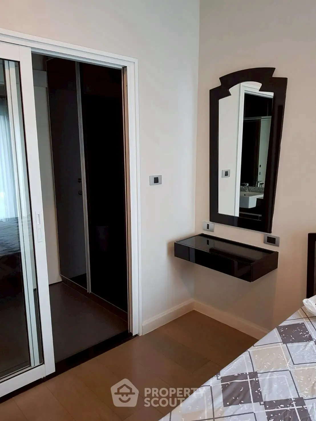 Modern bedroom with sleek design and sliding door closet